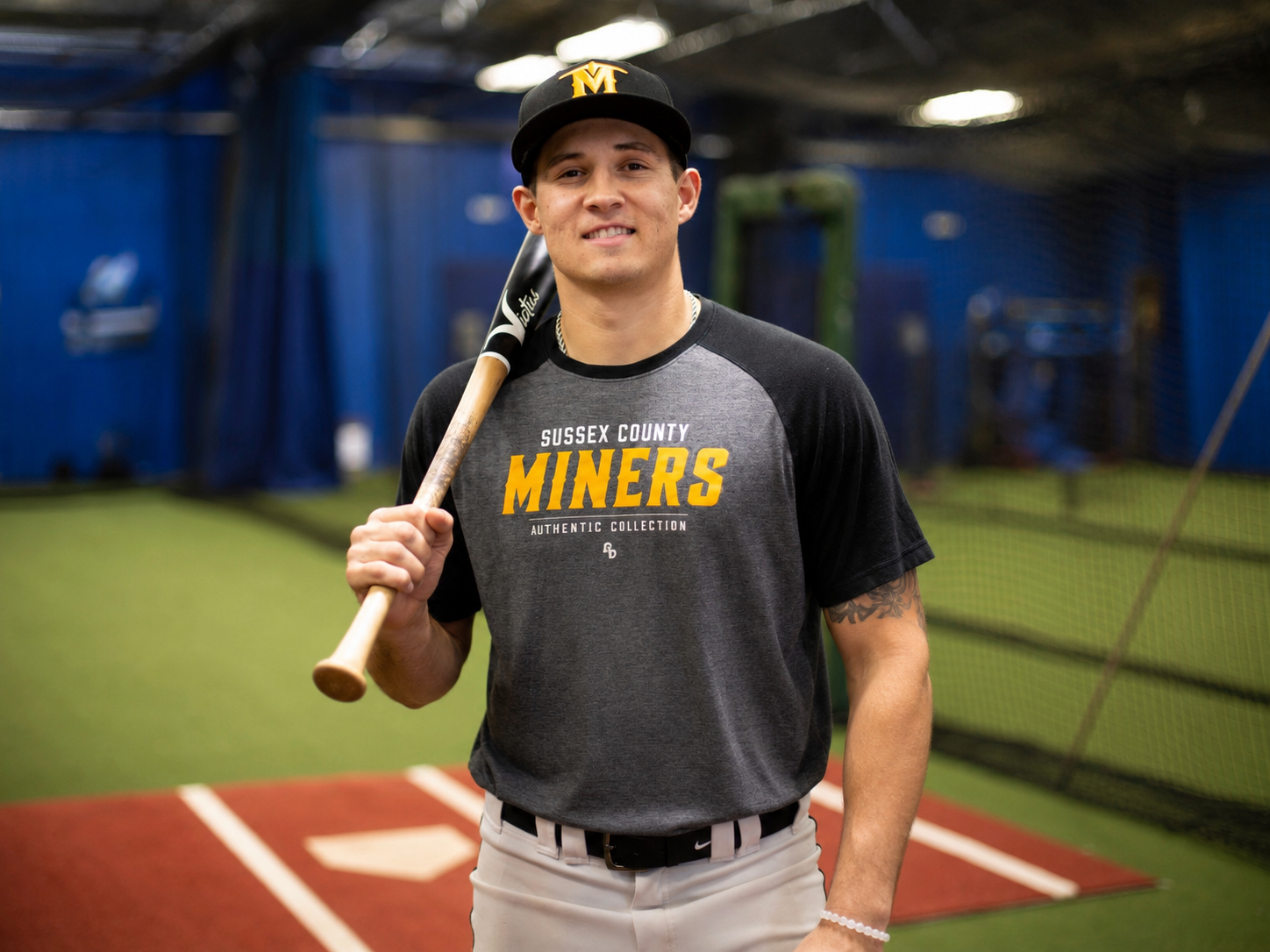 Sam Troyer, founder of Earn4, inside a baseball training facility.